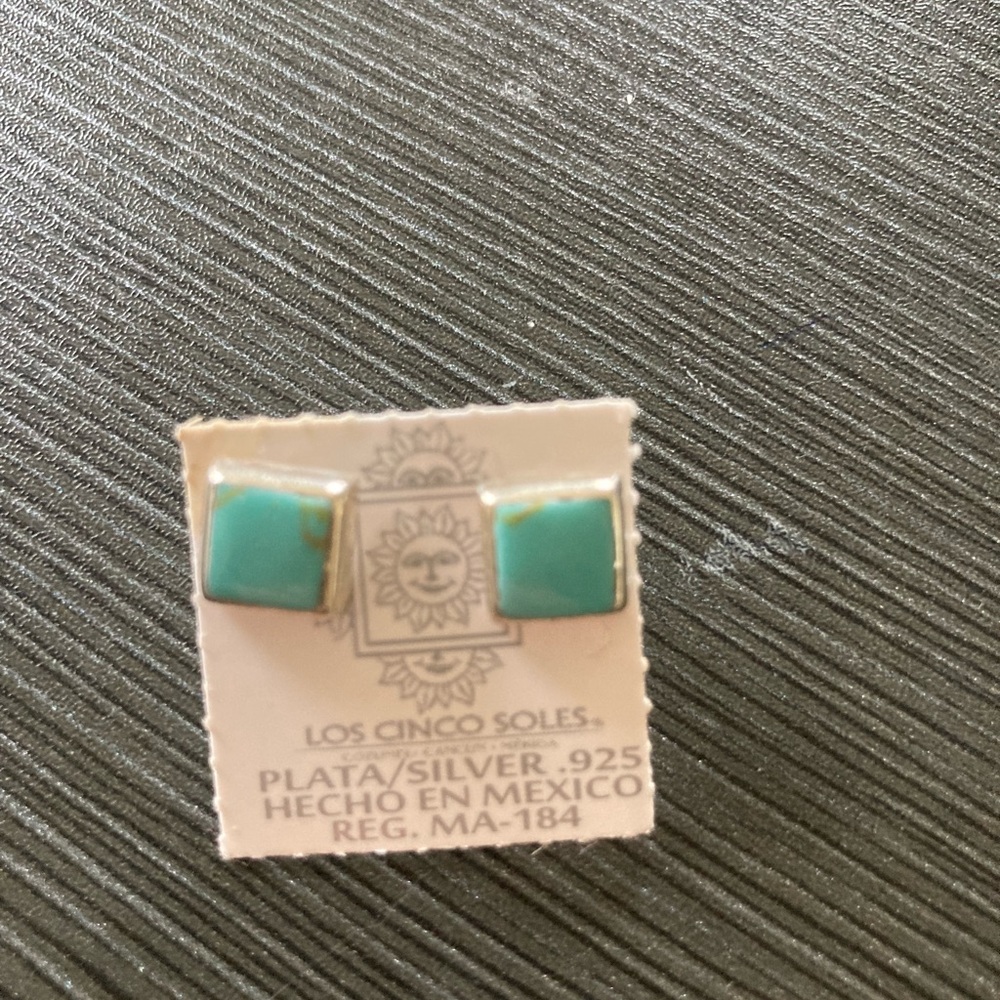 Los Cincos Soles sterling silver stud earrings.